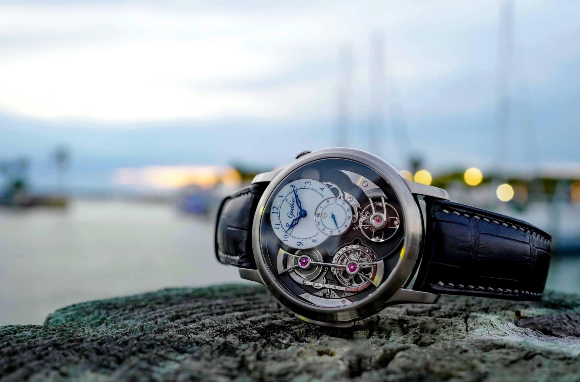 Luxury watch with intricate exposed mechanism.
