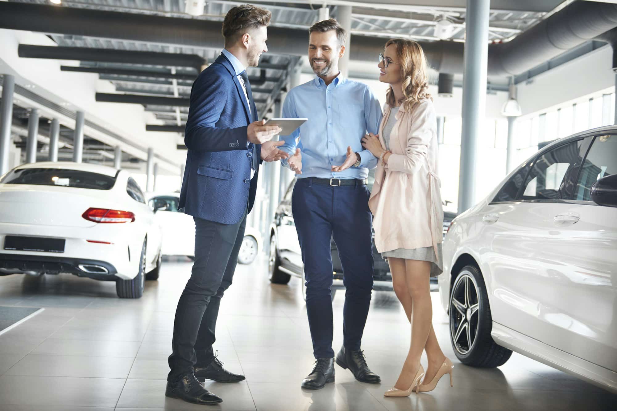 Couple purchasing brand new car