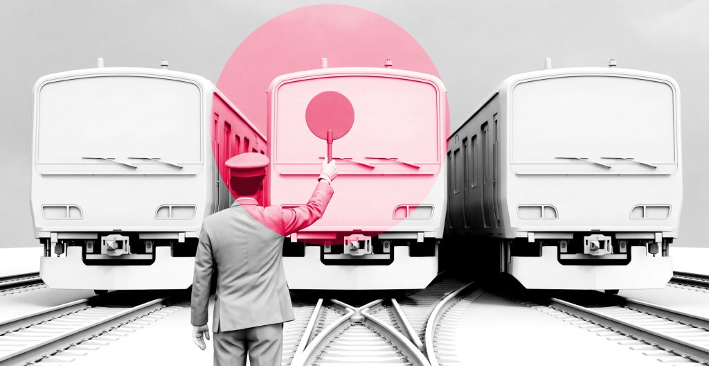 Black-and-white photo of a railway attendant raising a round stop paddle in front of three identical trains halted before one shared track, under a crimson circle.