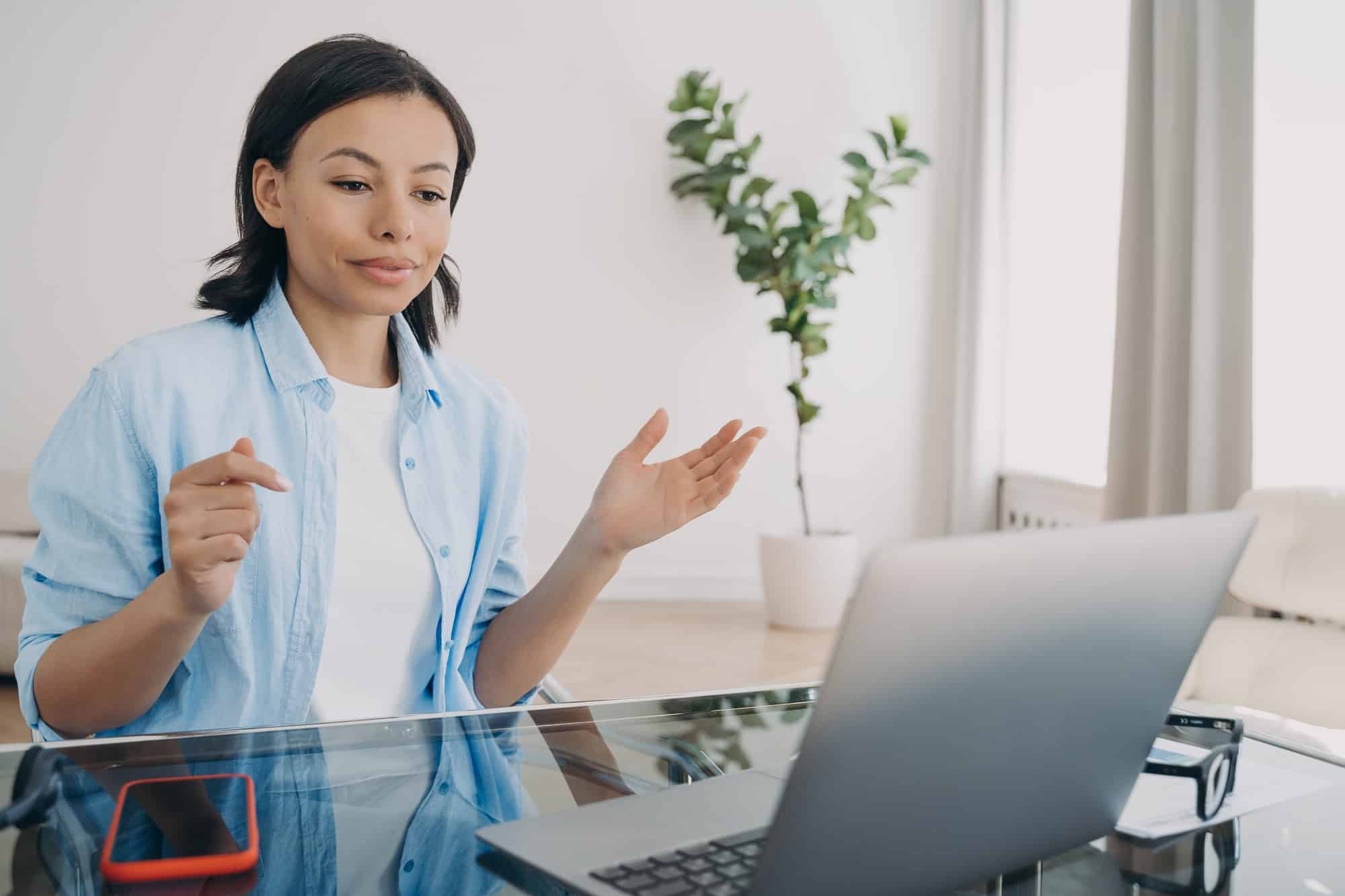 Businesswoman has group call via zoom. Online meeting and business development on quarantine.