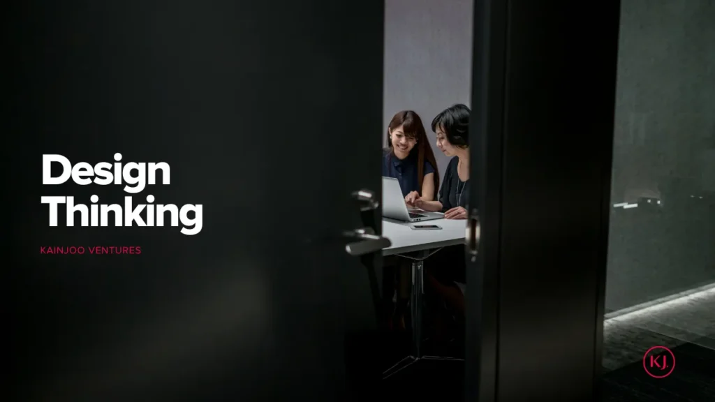 Two women collaborating on design thinking project.