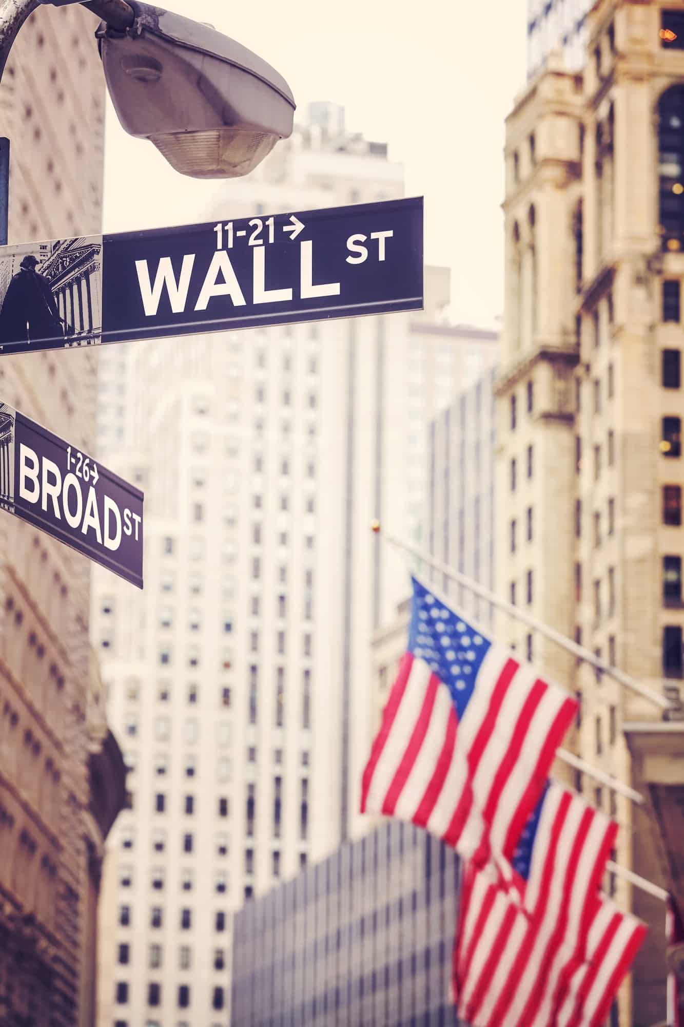Wall Street and Broad Street signs.